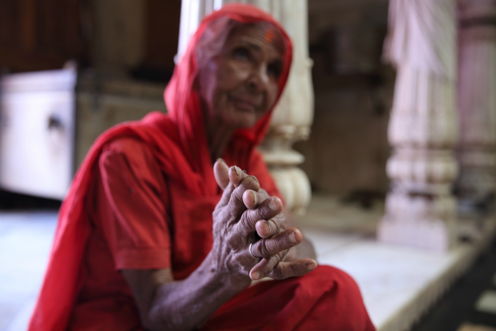 THE KARNI MATA RAT TEMPLE: Karni Mata is usually depicted in iconography as the crowned woman in red dress standing in front of a reclining lion, carrying a trident and surrounded by several brown rats and one white one, who are eating sweets off the floor by her feet.