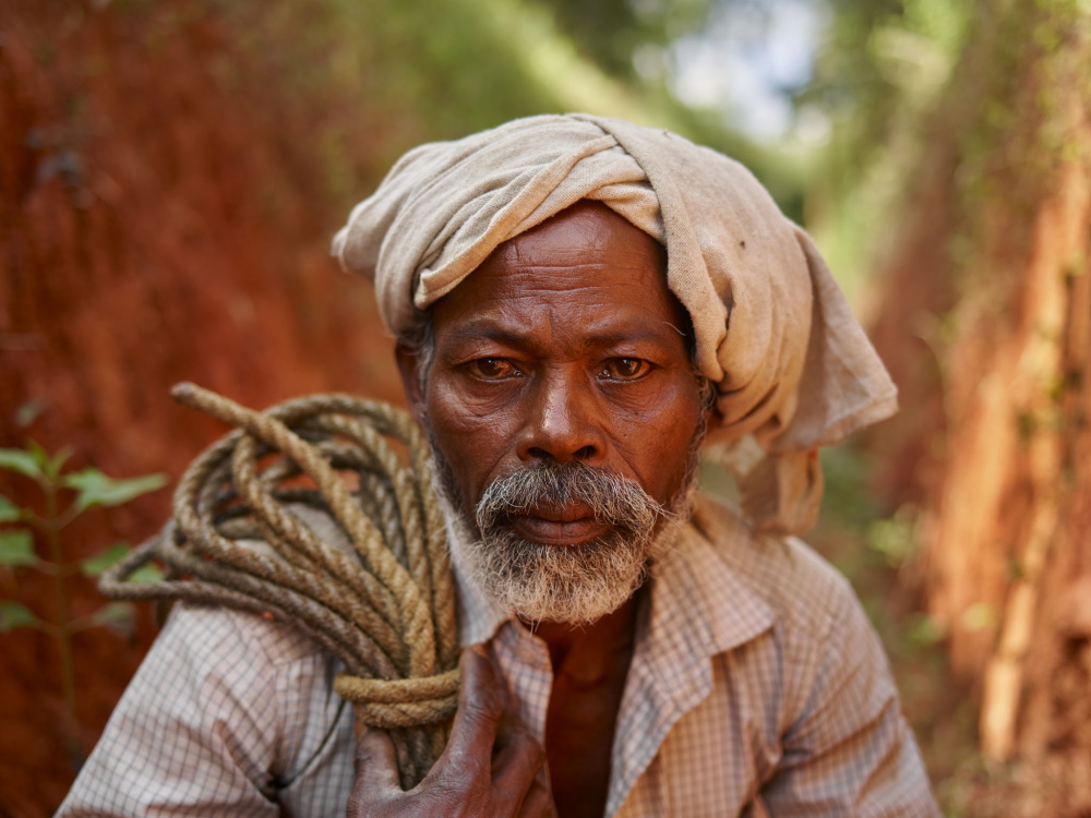 The Forest Gallery:Chukkan photographed in a trench which was dug to protect his tribal village from wild elephants.  