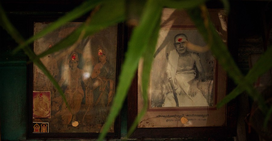THE MEDICINE MAN  -  A photograph of Kaashinatha Shetty, Narendranath’s grandfather, seen in the shop along with the pictures of Hindu Gods.
